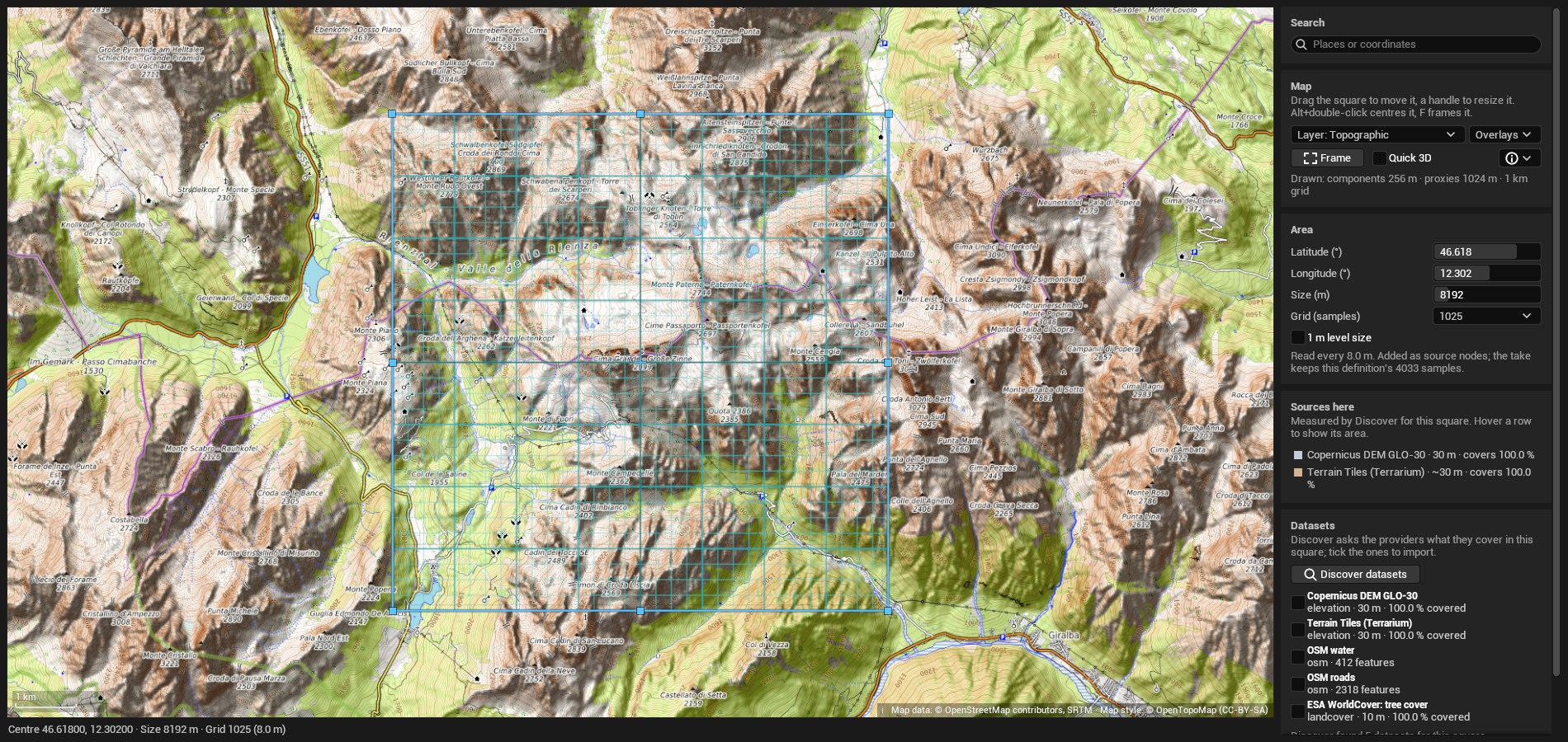 The GIS import tab. A topographic map of the Dolomites fills the left, with a blue square of about 8 km drawn over a mountain group and divided into a grid of landscape components. The right column has Search, Map (layer Topographic, Overlays, Frame, Quick 3D), Area (latitude 46.618, longitude 12.302, size 8192 m, grid 1025, an unticked '1 m level size' box, and the note 'Read every 8.0 m. Added as source nodes; the take keeps this definition's 4033 samples.'), Sources here (Copernicus DEM GLO-30 at 30 m and Terrain Tiles at about 30 m, each covering 100 percent), and Datasets with a Discover datasets button above five unticked results: two elevation sources, OSM water with 412 features, OSM roads with 2318 features, and ESA WorldCover tree cover at 10 m.